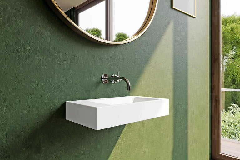 Salle de bain moderne avec lavabo à poser blanc, robinetterie et miroir