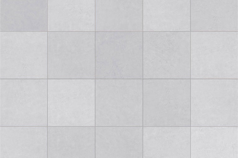 Carreaux de sol carrés aspect pierre discrète en vue de pose.