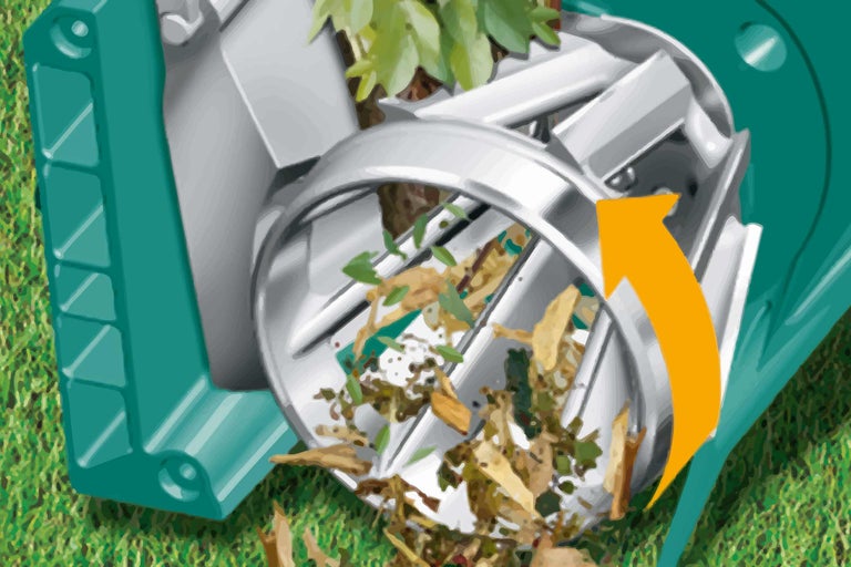 Appareil de jardin pour broyer les déchets de jardin avec entonnoir et flèche jaune