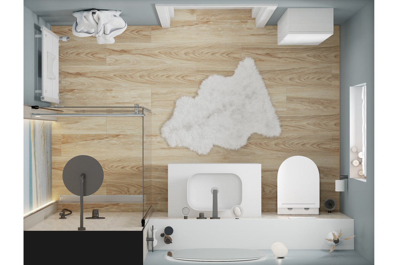 Vue de dessus d'une salle de bains lumineuse avec douche, lavabo, toilettes et parquet