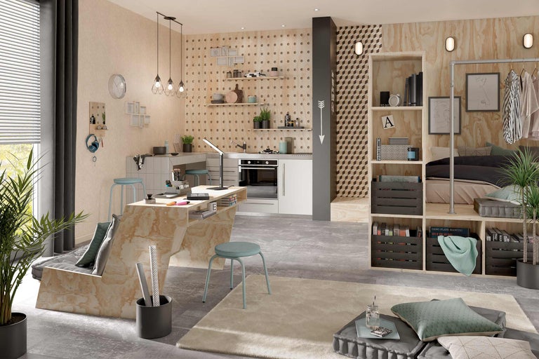 Intérieur lumineux avec bureau, cuisine et coin chambre dans un design moderne