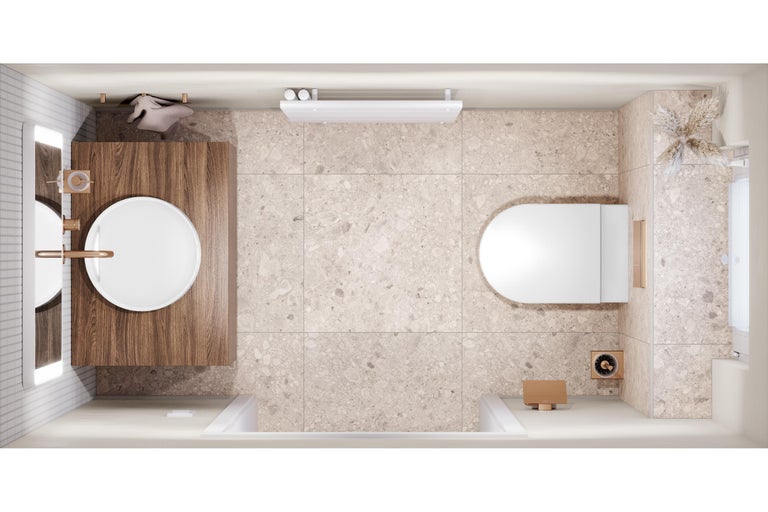 Vue de dessus d'une salle de bains avec meuble sous-vasque en bois, vasque à poser blanche, WC suspendu, robinetterie en bronze et carrelage aspect pierre.