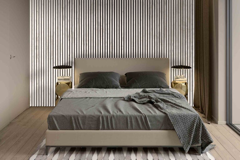 Chambre avec lit, tables de chevet et panneaux muraux dans un style moderne