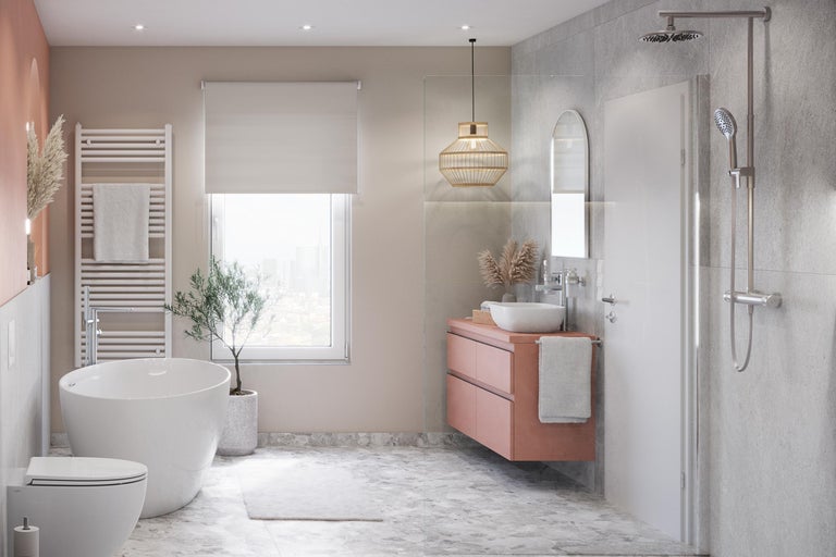 Salle de bains lumineuse avec baignoire, lavabo, douche et sèche-serviettes