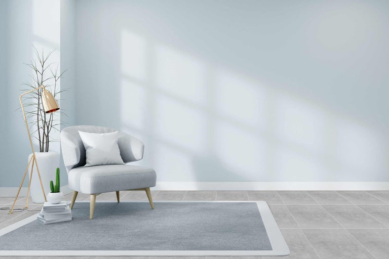 Salon avec fauteuil, tapis et lampadaire