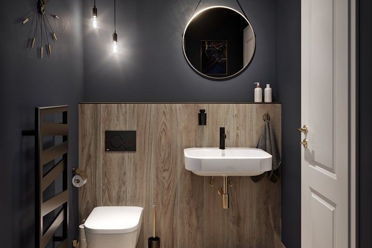 Salle de bain moderne avec toilettes, lavabo, miroir et radiateur