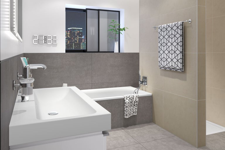 Salle de bains lumineuse avec lavabo, baignoire et serviette