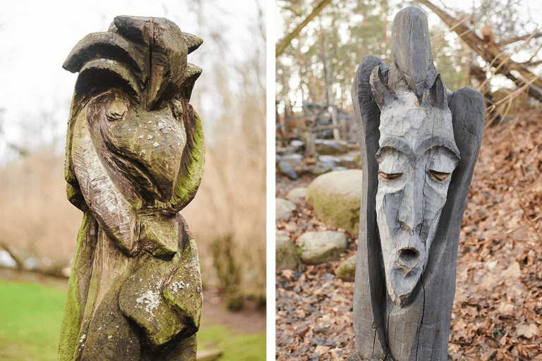 Zwei geschnitzte Holzstatuen im Außenbereich