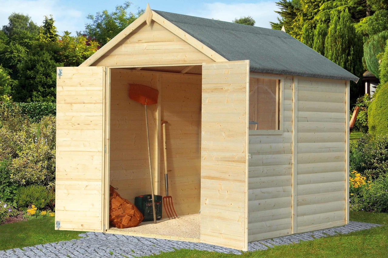 Abri de jardin en bois avec portes ouvertes, placé dans un jardin
