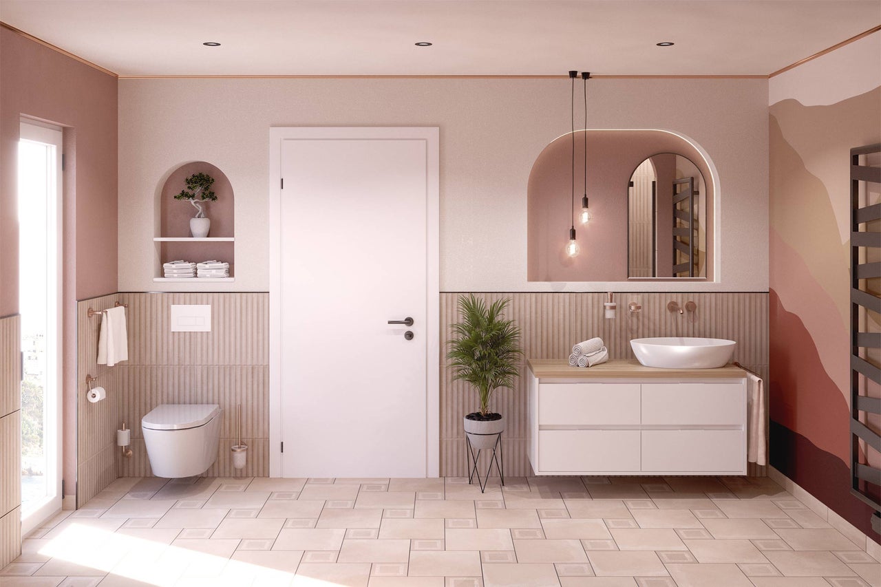 Salle de bain moderne avec WC, meuble-lavabo, miroir et radiateur.