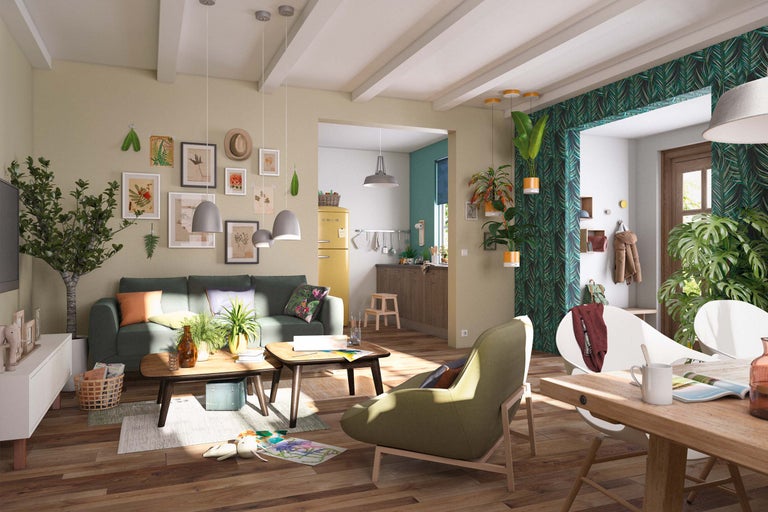 Salon lumineux avec canapé vert, tables en bois et décoration