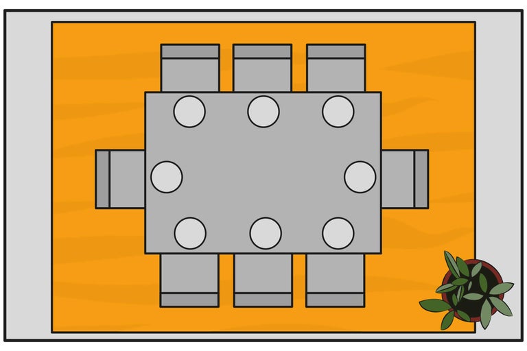 Vue de dessus d'une salle à manger avec table, chaises et plante d'intérieur sur un tapis