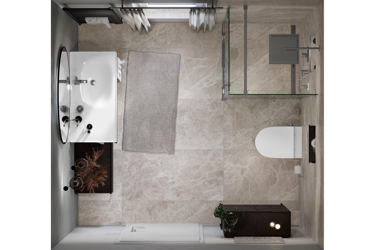 Vue de dessus d'une salle de bains avec baignoire, douche, toilettes et lavabo