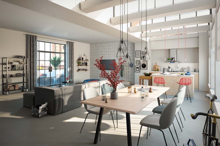 Pièce à vivre lumineuse avec canapé, table à manger, chaises et cuisine ouverte.