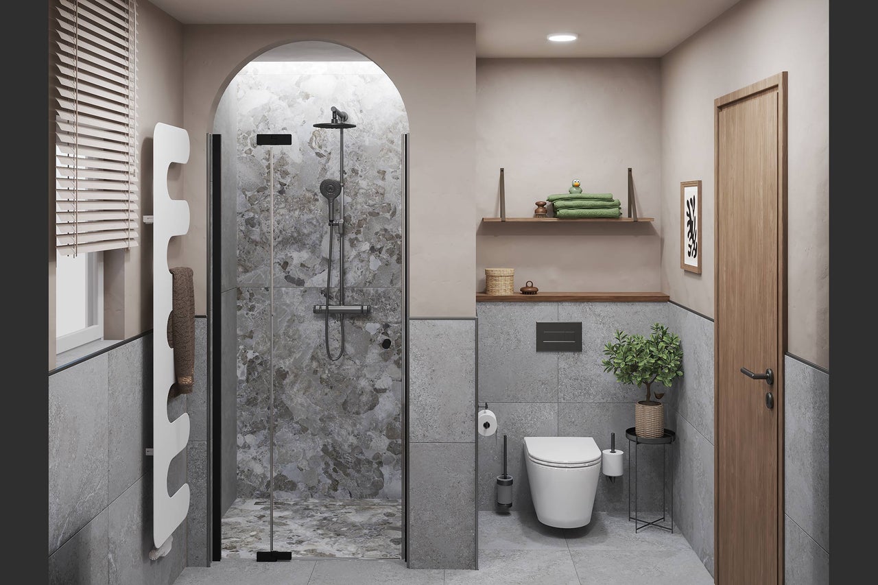 Salle de bains moderne avec douche à l'italienne voûtée, WC suspendu, radiateur design blanc et carreaux aspect pierre.