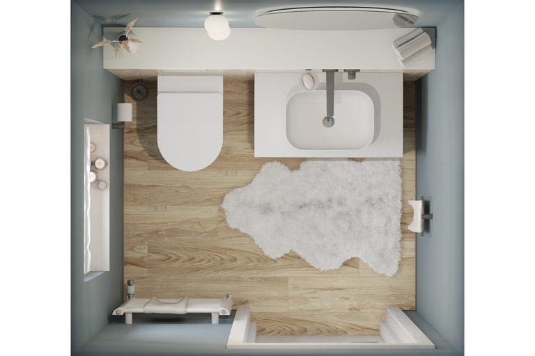 Vue de dessus d'une salle de bains avec toilettes, lavabo, baignoire et tapis de bain