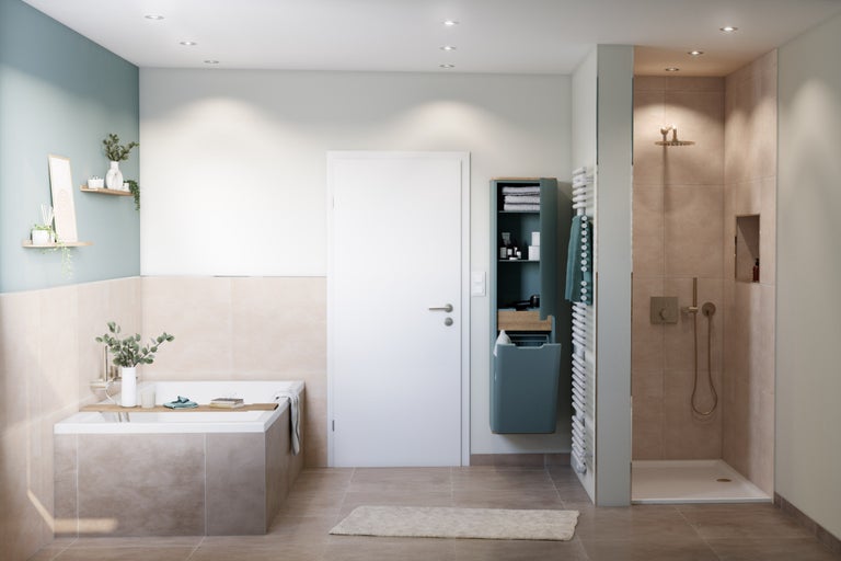 Salle de bain avec baignoire, douche, lavabo et sèche-serviettes pour une atmosphère claire et spacieuse