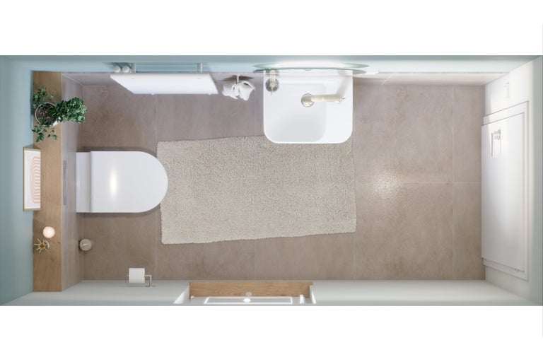 Vue de dessus d'une salle de bains avec toilettes, lavabo et tapis de bain