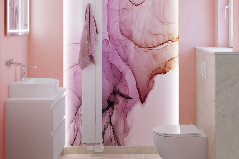 Salle de bain lumineuse avec lavabo, sèche-serviettes et toilettes