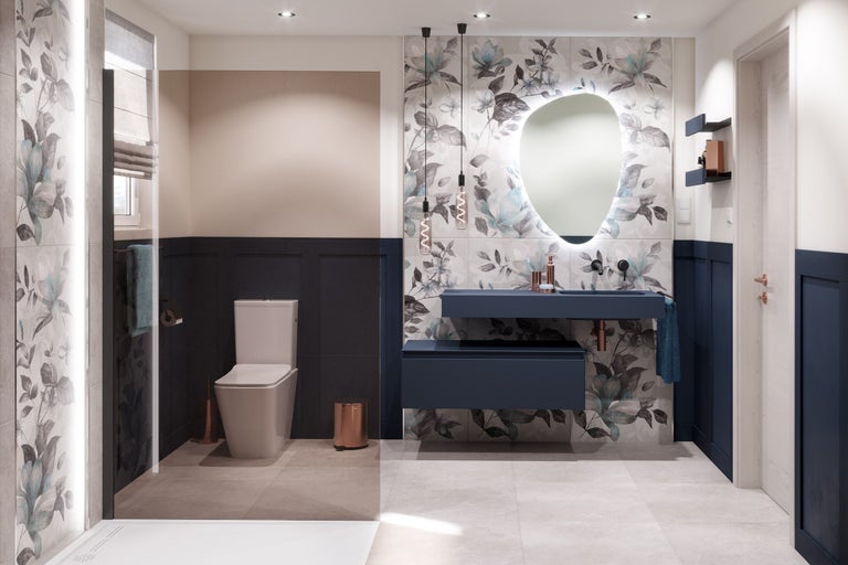 Salle de bains moderne avec toilettes, lavabo, miroir avec éclairage et carrelage à motifs floraux