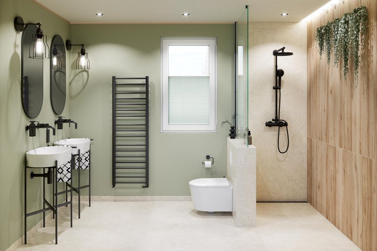 Salle de bains moderne avec deux vasques, miroirs ovales, sèche-serviettes noir, toilettes suspendues et douche avec panneaux muraux aspect bois.