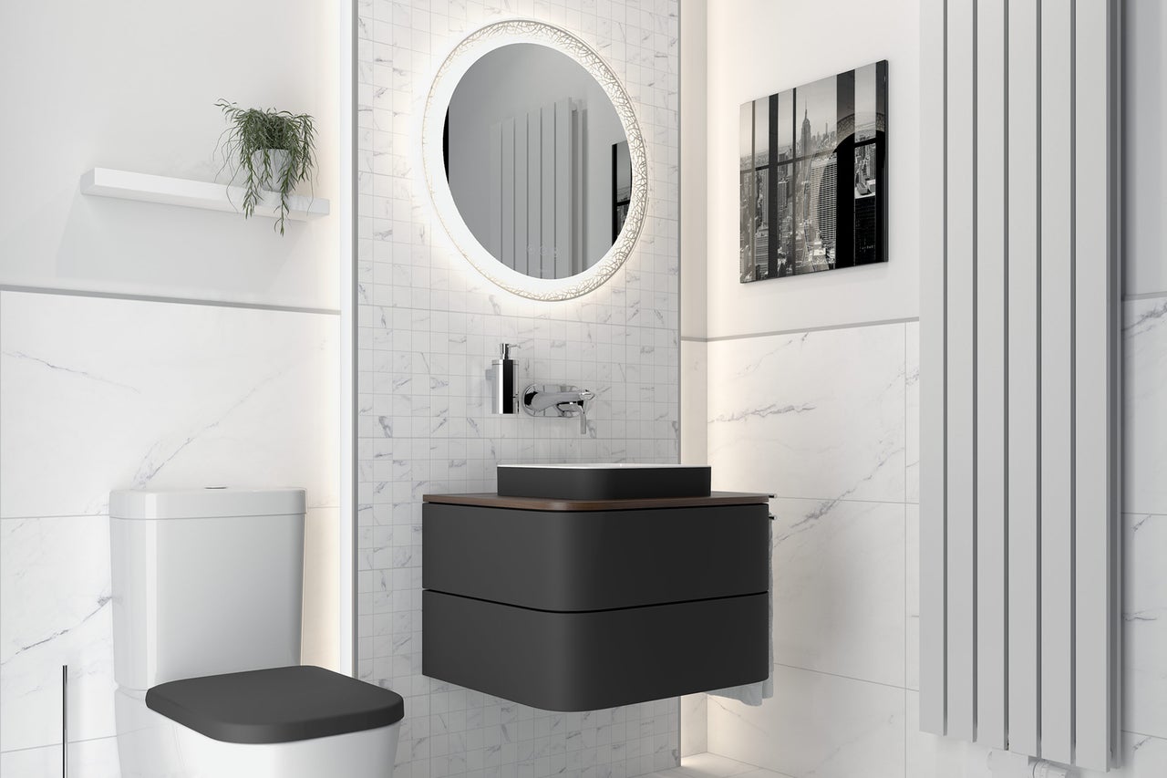 Salle de bains moderne avec WC, meuble sous-vasque, miroir et radiateur