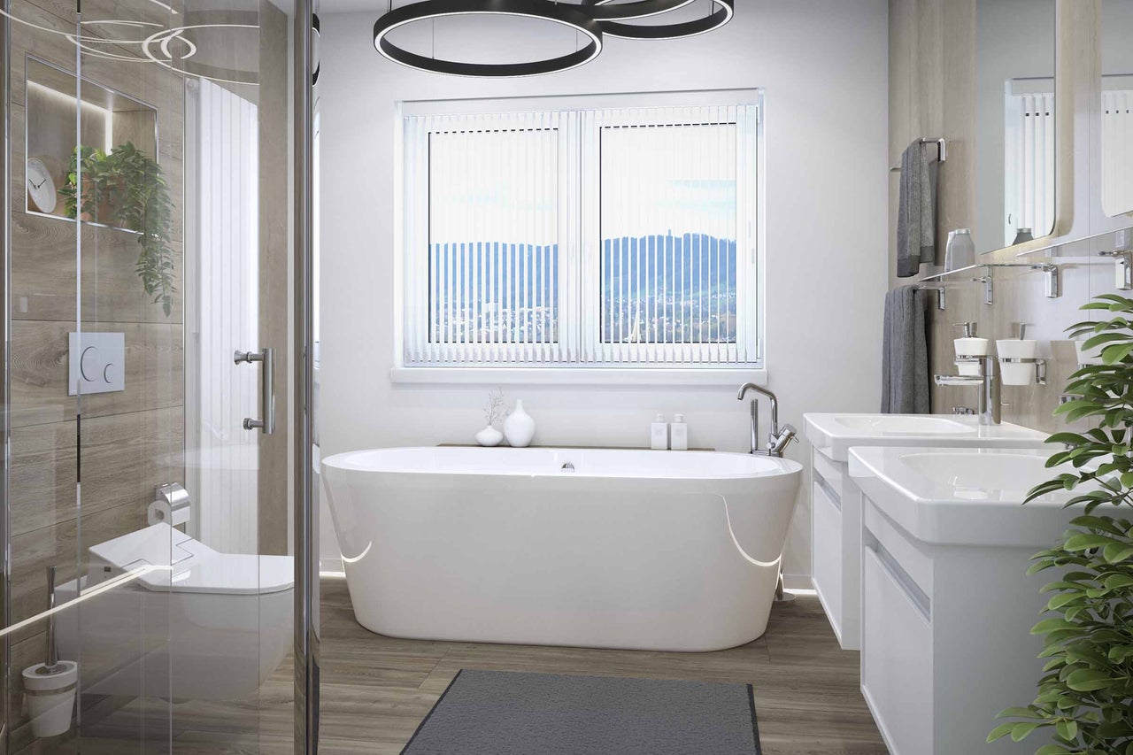 Salle de bain lumineuse avec baignoire, lavabo et douche