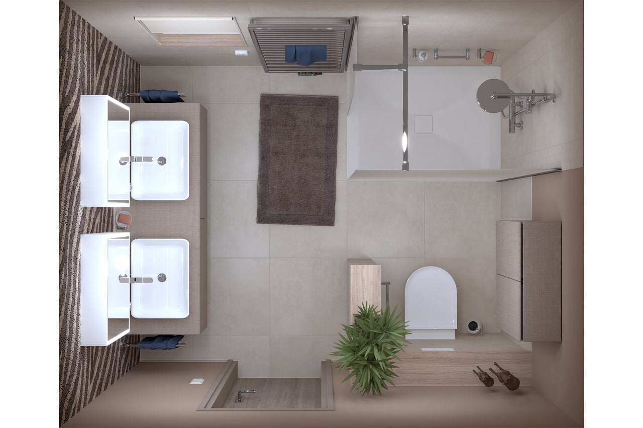 Vue de dessus d'une salle de bains avec lavabos, douche et toilettes