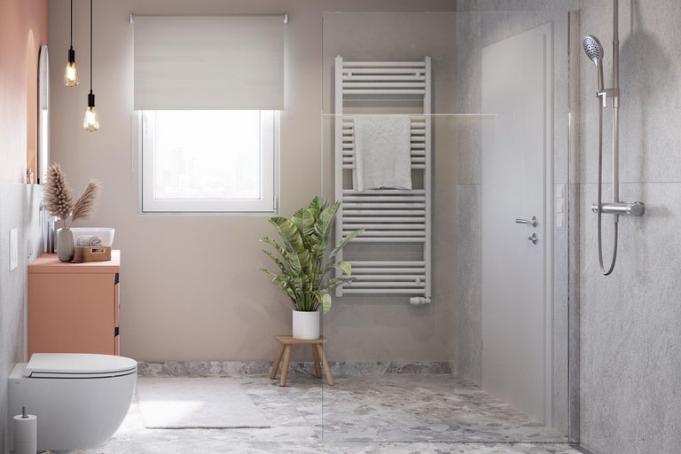 Salle de bain moderne avec WC, lavabo, radiateur et cabine de douche pour une ambiance élégante