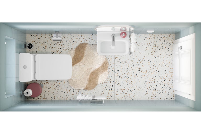 Vue de dessus d'une salle de bains lumineuse et moderne avec sol en terrazzo, carrelage bleu clair, lavabo, toilettes et tapis de forme irrégulière.