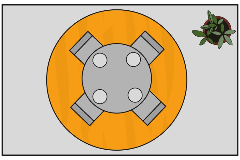 Vue de dessus d'un élément de fixation à quatre bras sur une surface ronde et d'une plante en pot