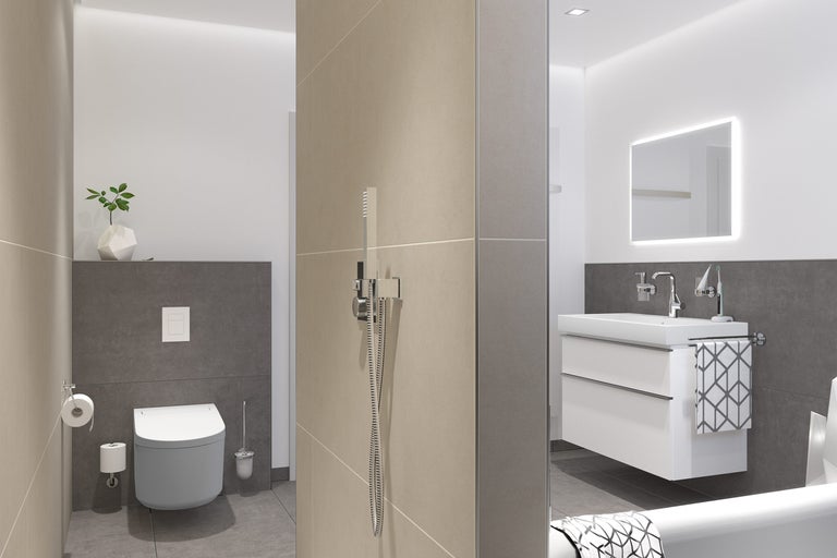 Salle de bains lumineuse avec WC, meuble sous-lavabo et douche