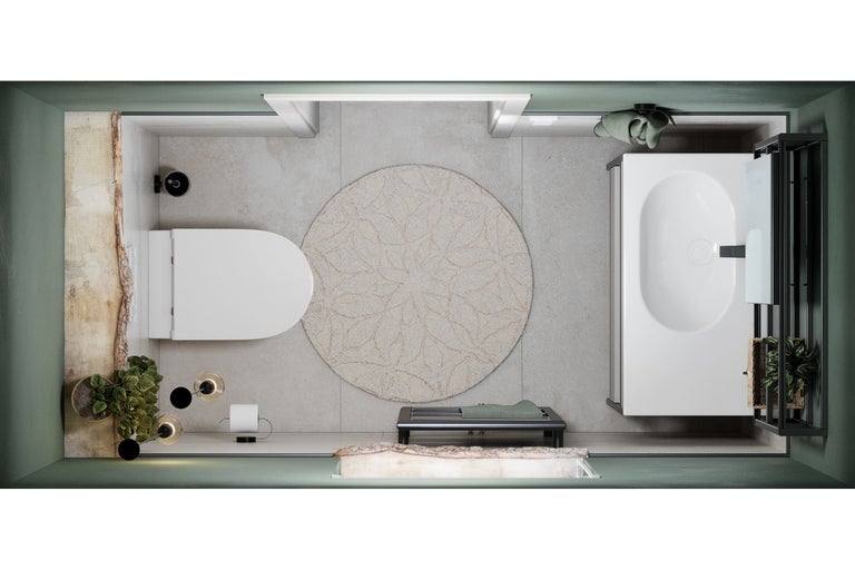 Badezimmeransicht von oben mit Badewanne, Toilette und rundem Teppich