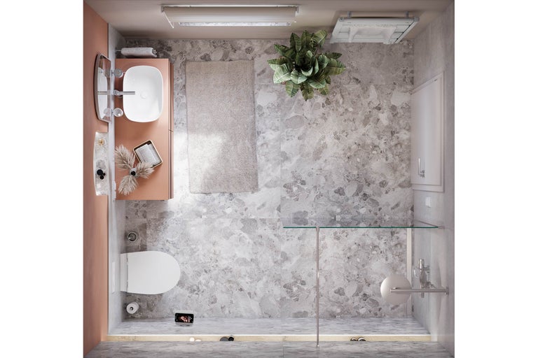 Vue de dessus d'une salle de bains avec toilettes, lavabo, douche et tapis de bain.