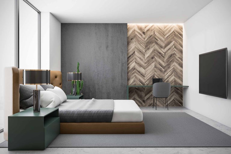 Chambre à coucher avec lit, bureau et télévision au mur