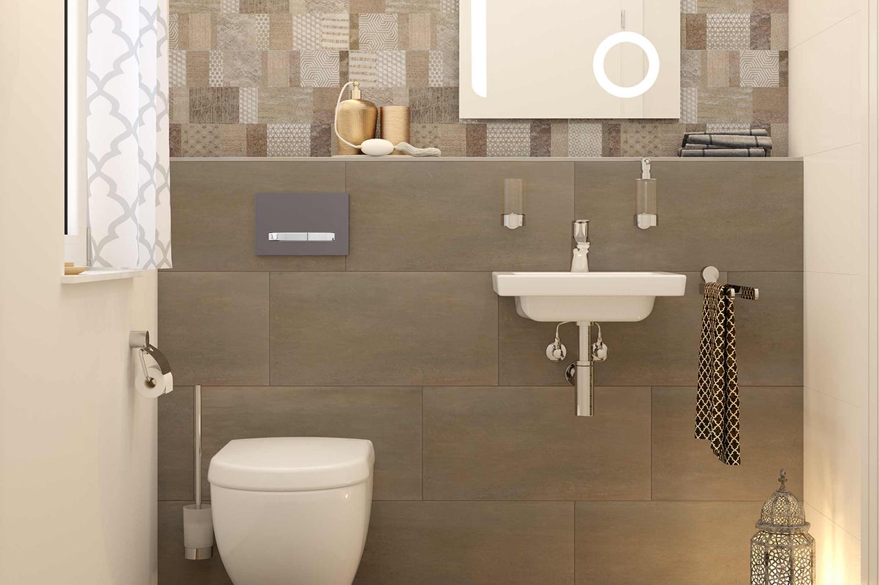 Salle de bain lumineuse avec toilettes, lavabo et mur carrelé