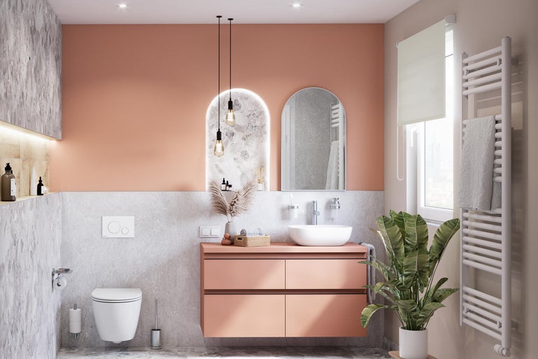 Salle de bain moderne avec lavabo, miroir, radiateur et toilettes pour un aménagement élégant
