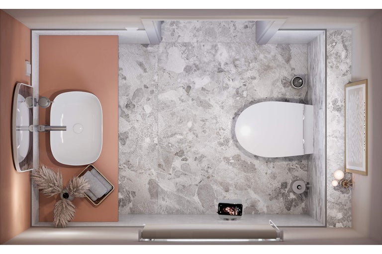 Vue plongeante d'une salle de bains avec lavabo, toilettes et carrelage