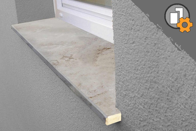 Rebord de fenêtre en pierre sur une façade