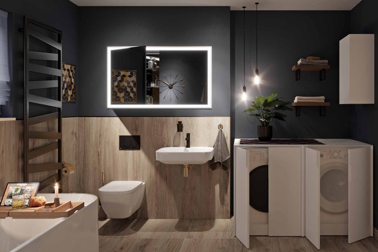 Modernes Badezimmer mit Waschbecken, Toilette, beleuchtetem Spiegel und Waschmaschine