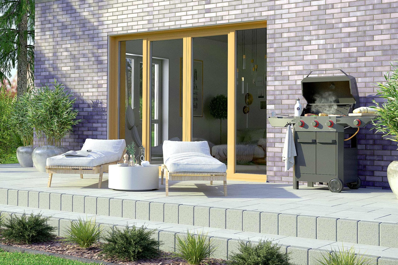 Terrasse avec mobilier de jardin et barbecue