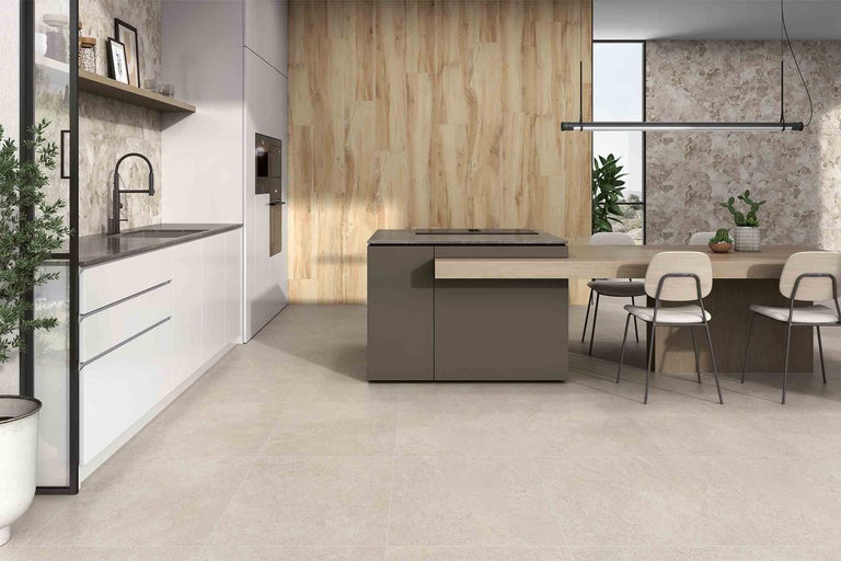 Espace cuisine lumineux et convivial avec coin repas et mobilier moderne.