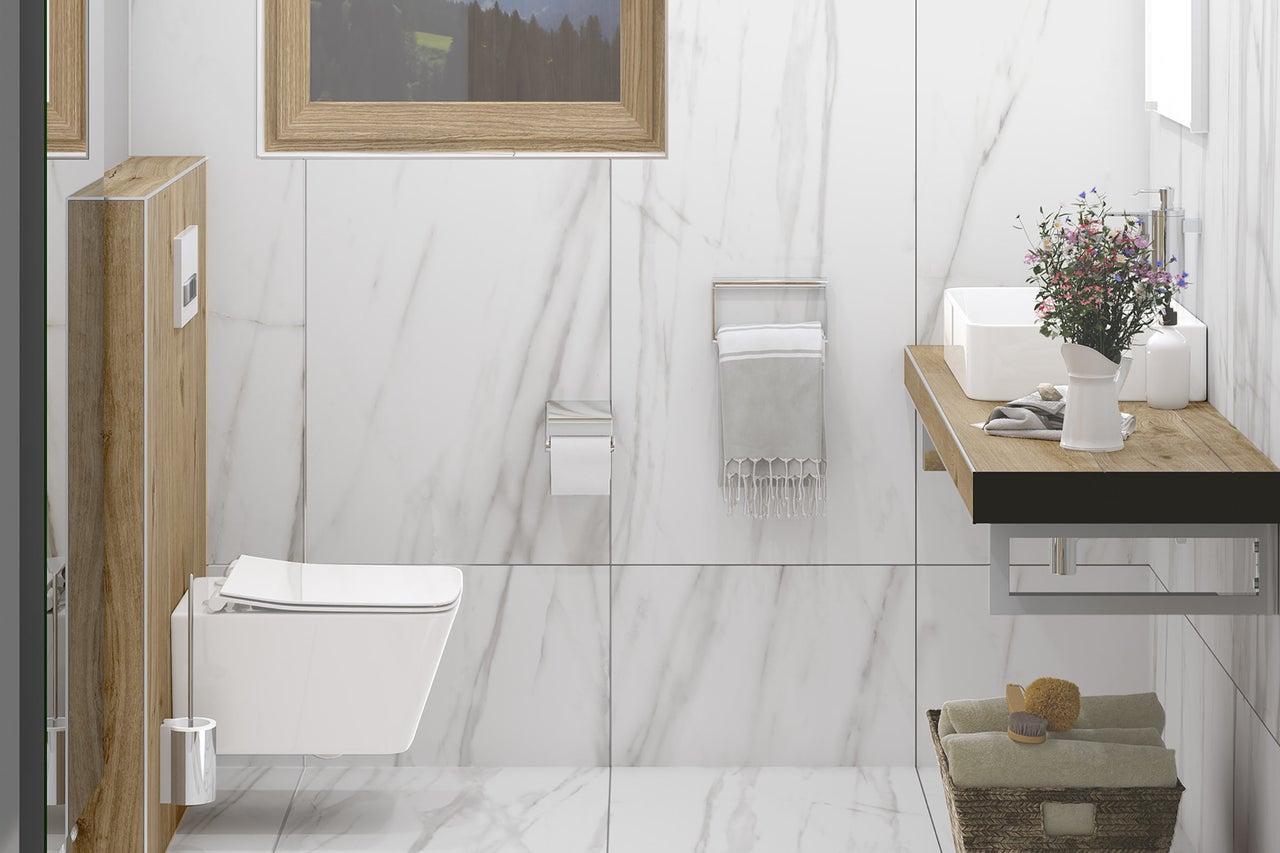 Salle de bain moderne avec toilettes, lavabo et éléments en bois