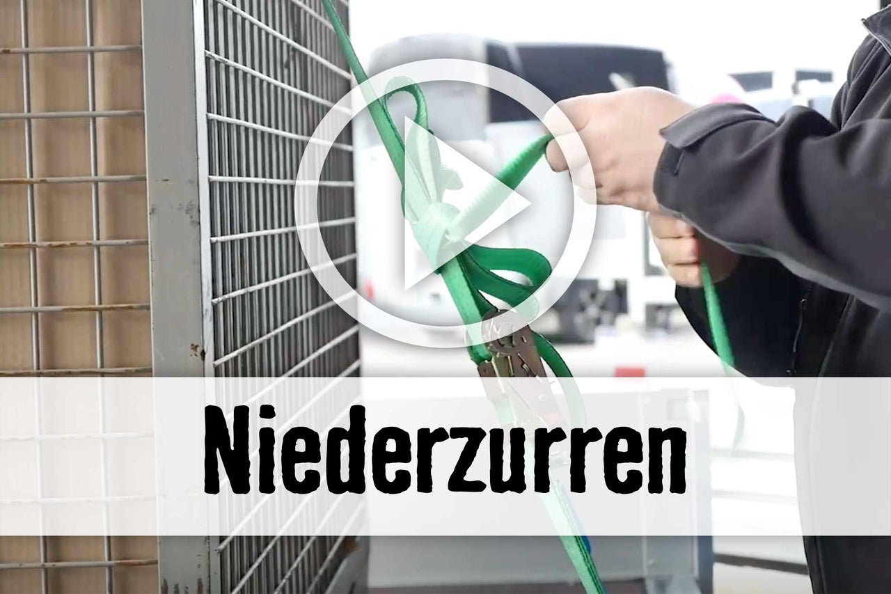 
			Anwendung einer Zurrgurt-Niederzurrung
		