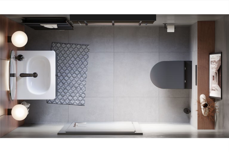 Vogelperspektive eines Badezimmers mit Waschbecken, Toilette, Duschwanne und Badteppich