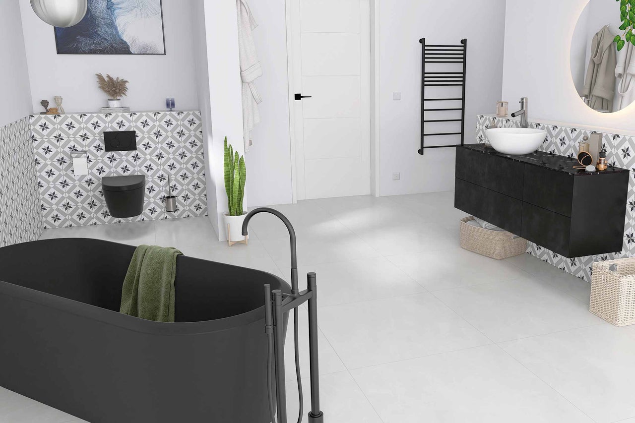Salle de bain moderne avec baignoire îlot, meuble-lavabo avec vasque à poser et carrelage à motifs