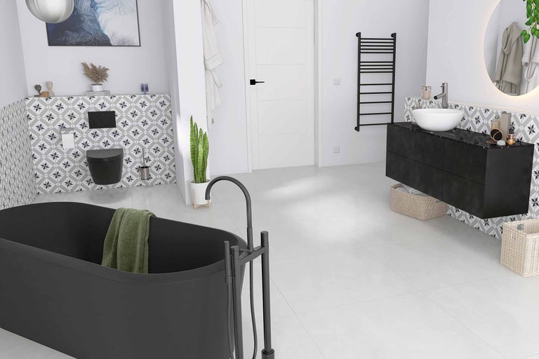 Salle de bain moderne avec baignoire îlot, meuble-lavabo avec vasque à poser et carrelage à motifs