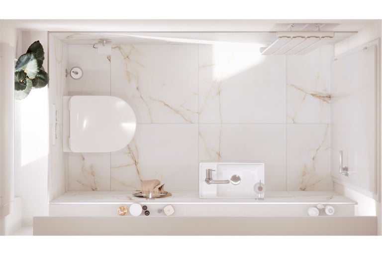 Vue d'ensemble d'une salle de bains avec toilettes, lavabo et douche