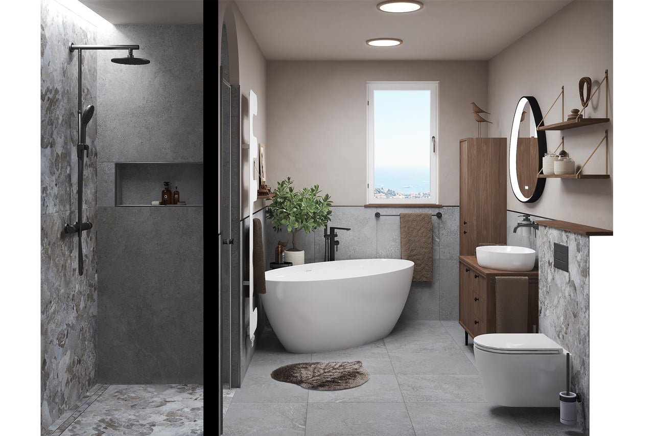 Salle de bains moderne avec douche à l'italienne, baignoire en îlot, meuble en bois, vasque à poser, miroir éclairé et carrelage gris aspect pierre.