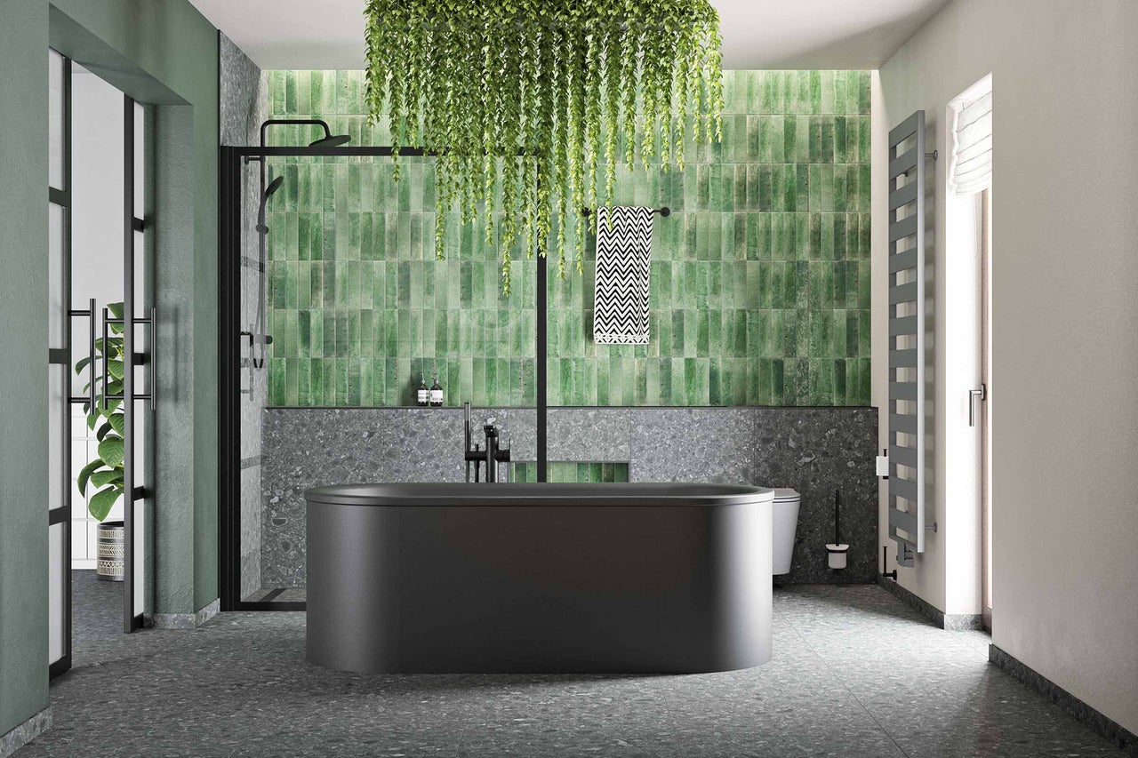 Salle de bains avec baignoire îlot, douche et carrelage vert
